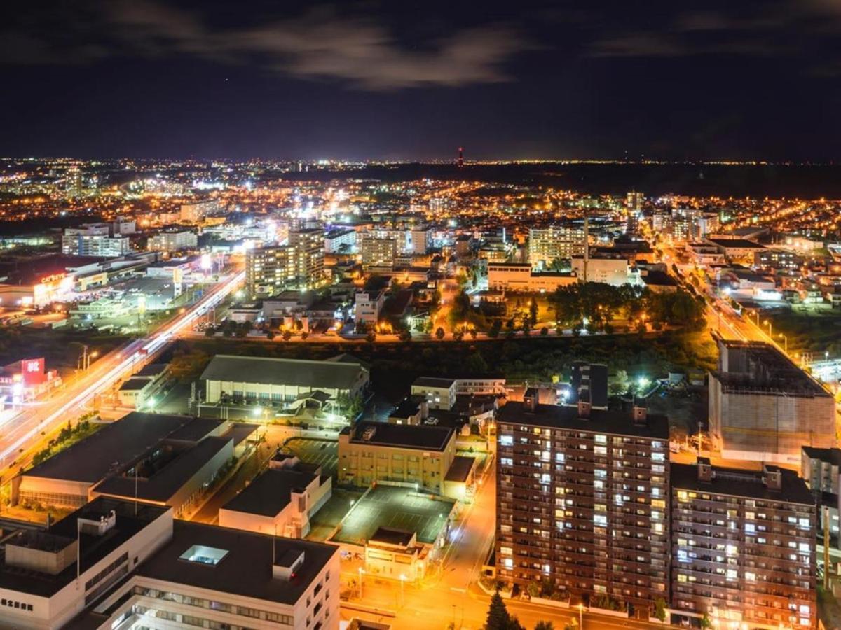 Hotel Emisia Sapporo Eksteriør billede Aerial view of the city at night